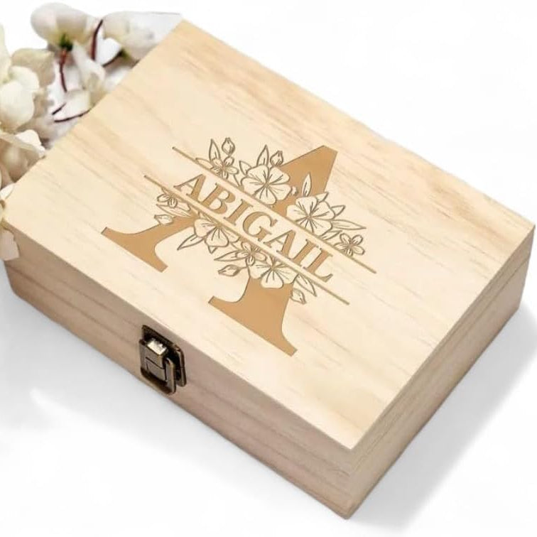 Wooden box with engraved name 'Abigail' on a white background